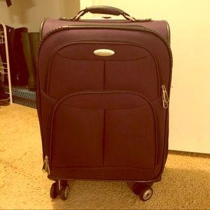 Purple Samsonite carry luggage